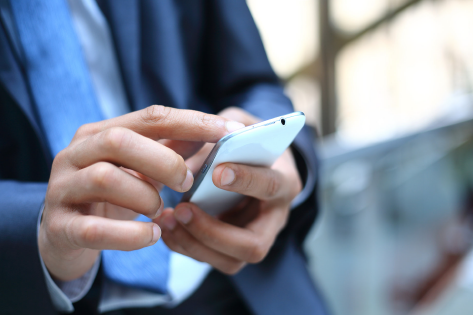Teacher holding mobile phone